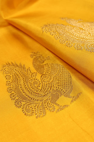 Goldenrod Yellow Kanjivaram Silk Saree with peacock motifs and zari border