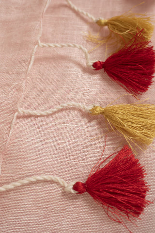 Blush pink linen saree with gold zari border and tassels