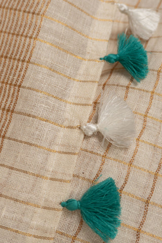 Linen saree with gold zari and teal border