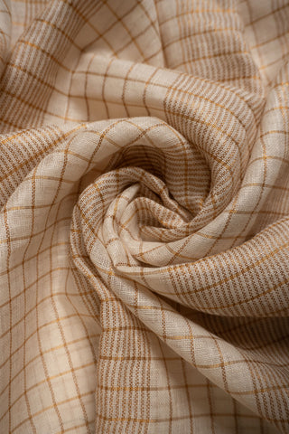 Linen woven gold zari check saree with tassels