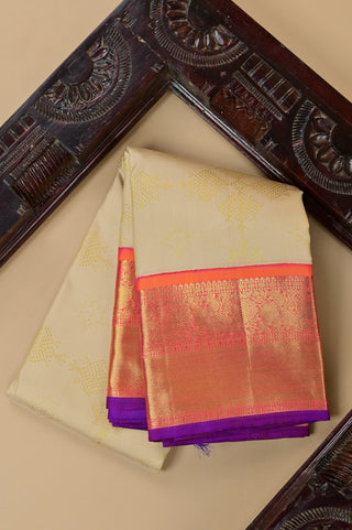 Cream Kanjivaram silk saree with orange and purple zari border
