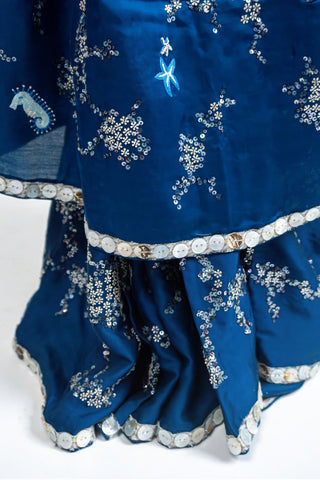 Ocean blue satin saree with silver embroidery and sea motifs