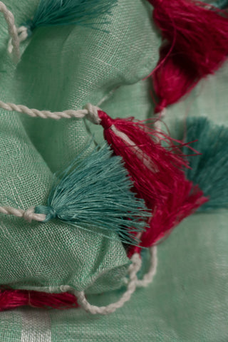 Pastel mint linen saree with magenta contrast border