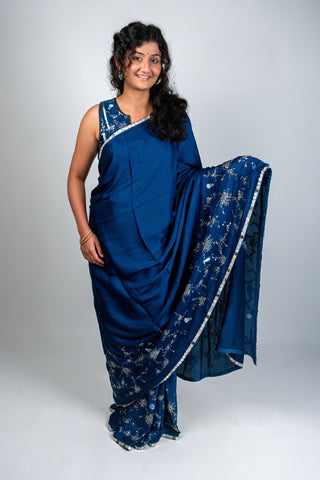 Ocean blue satin saree with silver embroidery and sea motifs