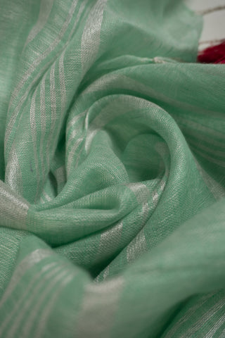 Pastel mint linen saree with magenta contrast border