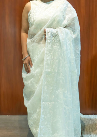 Pearl white pure silk organza saree with Parsi Gara floral and bird embroidery.