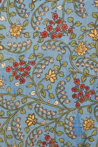Sky blue Kalamkari saree with hand-painted floral vines, delicate gold zari border and hand-tied tassels