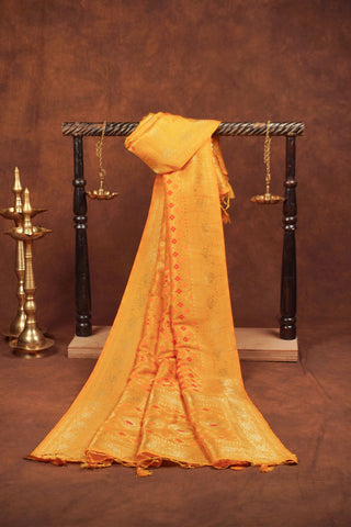 Marigold yellow Banarasi dupatta with gold zari diamond jaal, red and orange meenakari florals and woven pallu with tassels