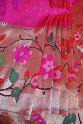 Bright pink Paithani saree with gold zari grid checks and a gold tissue pallu of multicolour floral vines