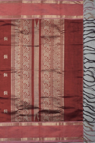 Rich maroon pure silk saree with gold zari Yali motifs and contrasting peach pink fish motif border