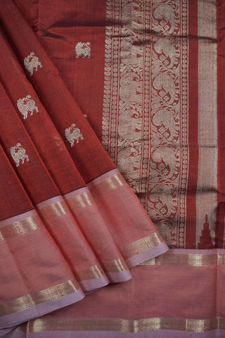 Rich maroon pure silk saree with gold zari Yali motifs and contrasting peach pink fish motif border