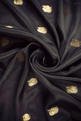 Black crepe silk saree with scattered gold peacock buttis, magenta pink border and zari striped pallu