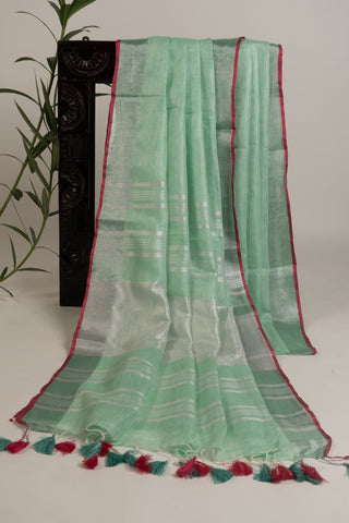 Pastel mint linen saree with magenta contrast border