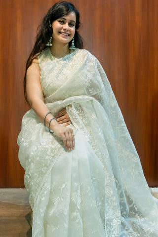 Pearl white pure silk organza saree with Parsi Gara floral and bird embroidery.