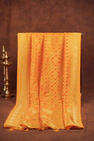 Marigold yellow Banarasi dupatta with gold zari diamond jaal, red and orange meenakari florals and woven pallu with tassels