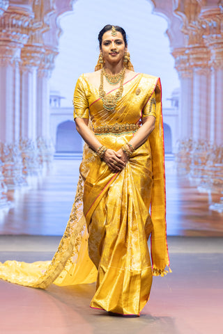 Gold Kanjivaram silk saree with floral jaal and pink contrast border