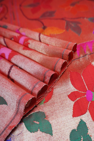 Bright pink Paithani saree with gold zari grid checks and a gold tissue pallu of multicolour floral vines