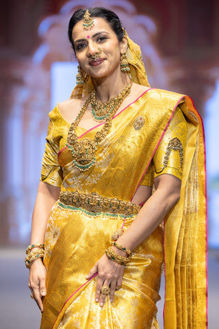 Gold Kanjivaram silk saree with floral jaal and pink contrast border