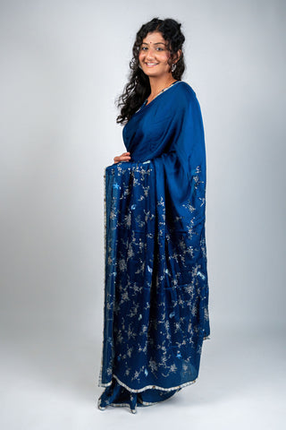 Ocean blue satin saree with silver embroidery and sea motifs