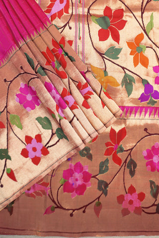 Bright pink Paithani saree with gold zari grid checks and a gold tissue pallu of multicolour floral vines