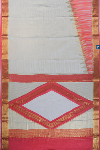 Ivory saree with gold zari checks, coral pink stripes and a triangular zari pattern leading into the pallu