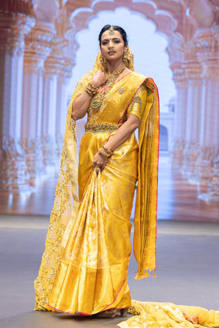 Gold Kanjivaram silk saree with floral jaal and pink contrast border