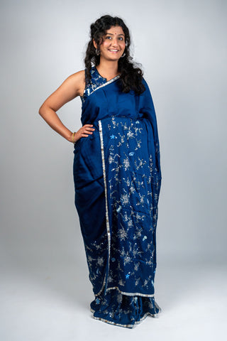 Ocean blue satin saree with silver embroidery and sea motifs