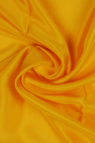 Mustard yellow crepe silk saree with zari border