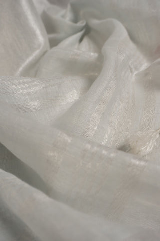 White linen saree with magenta border and tassels