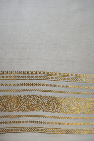 Pink crepe silk saree with fine gold checks, off-white paisley zari border and off-white striped pallu