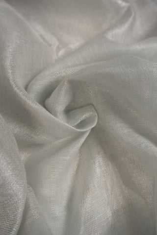 White linen saree with magenta border and tassels