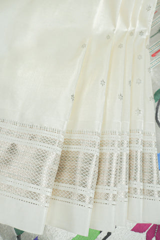 Off-white Paithani saree with silver zari stripes and a silver tissue pallu with a peacock and flower tree