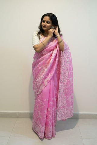Bubblegum pink pure silk organza saree with Parsi Gara floral and bird embroidery.