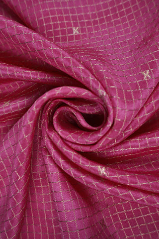 Pink crepe silk saree with fine gold checks, off-white paisley zari border and off-white striped pallu