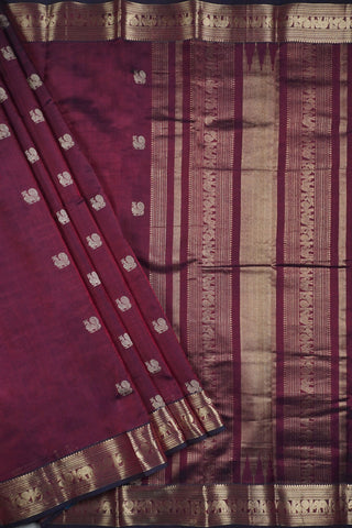 Deep aubergine pure silk saree with gold zari peacock motifs and elephant peacock striped pallu panels