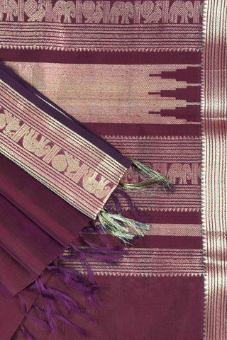 Deep aubergine pure silk saree with gold zari peacock motifs and elephant peacock striped pallu panels