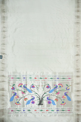 Off-white Paithani saree with silver zari stripes and a silver tissue pallu with a peacock and flower tree