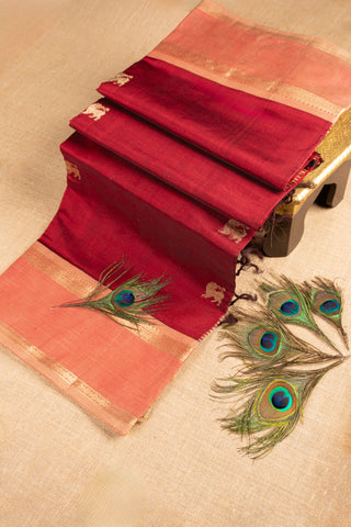 maroon handwoven silk cotton saree with lion buttas and temple border handcrafted saree from Madhurya