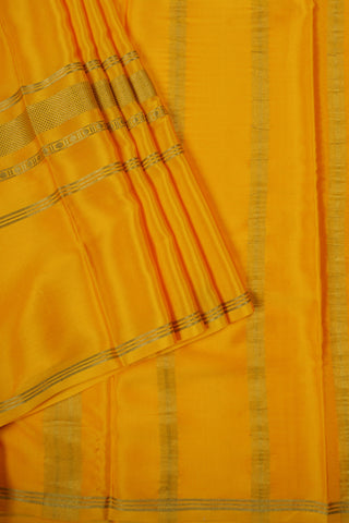Mustard yellow crepe silk saree with zari border