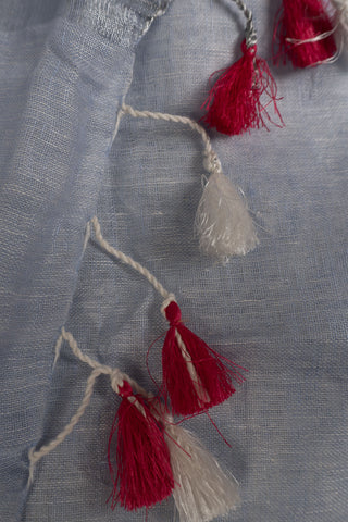 Pastel blue linen saree with zari border