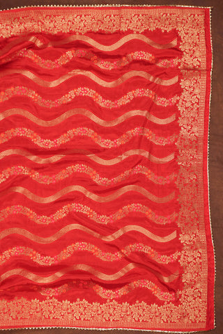 Red art silk dupatta with wavy gold zari leheriya lines, pink and orange meenakari vines and gold kiran lace edging