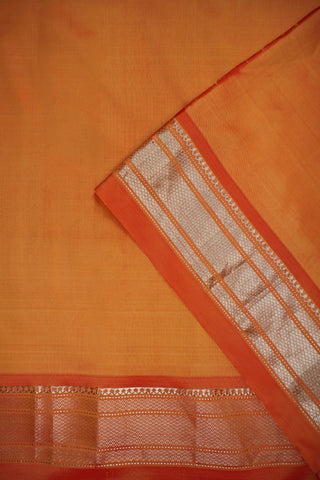 Orange Paithani silk saree with light gold buttis and a tissue pallu of circular chakra motifs with peacocks