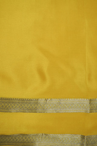 Draped off-white silk saree with a plain body, mustard yellow twin zari stripe border and yellow striped pallu