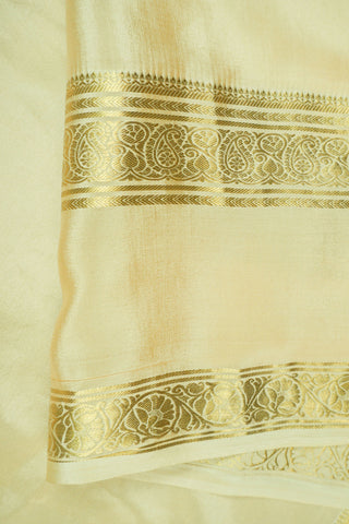 Coffee brown crepe silk saree with small gold floral buttas, paisley zari border and contrasting beige blouse