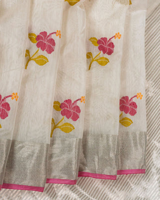 Off-white silk cotton Chanderi saree with pink hibiscus motifs and silver zari striped pallu