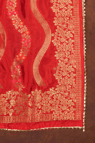 Red art silk dupatta with wavy gold zari leheriya lines, pink and orange meenakari vines and gold kiran lace edging