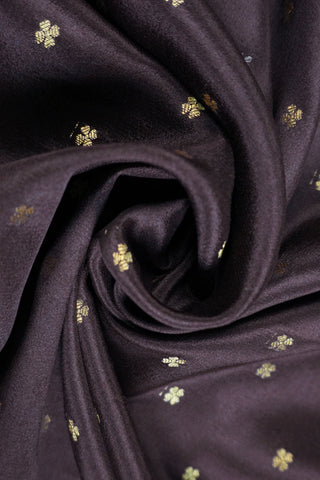 Coffee brown crepe silk saree with small gold floral buttas, paisley zari border and contrasting beige blouse