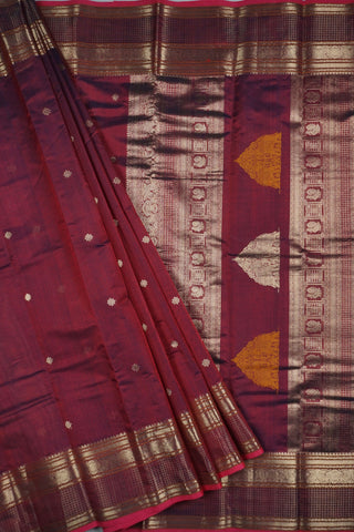 Rich wine and navy blue shot silk saree with gold zari elephant and peacock arch motifs on the pallu