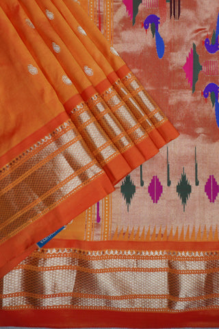 Orange Paithani silk saree with light gold buttis and a tissue pallu of circular chakra motifs with peacocks