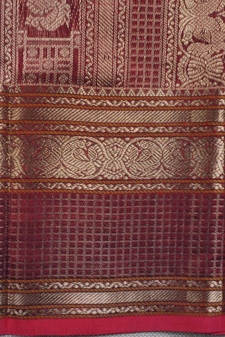 Rich wine and navy blue shot silk saree with gold zari elephant and peacock arch motifs on the pallu
